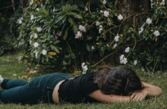 woman planking on the grass